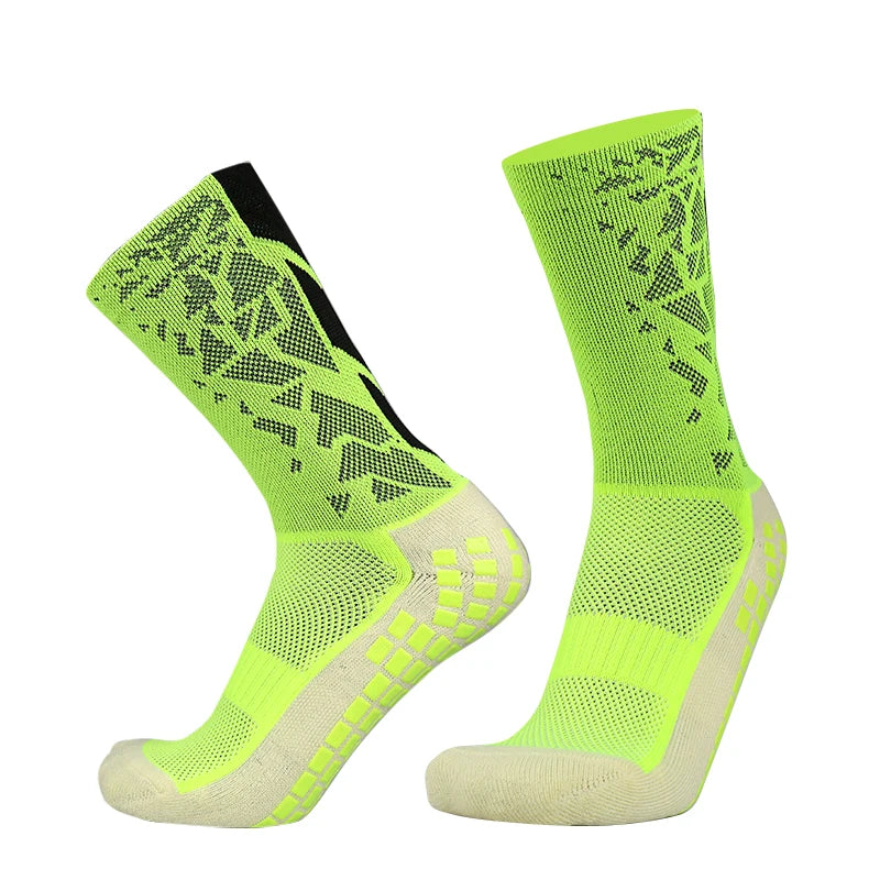 A pair of neon yellow mesh sports socks with black accents shown from the side.