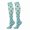 A pair of light blue compression elastic socks with black polka dots.