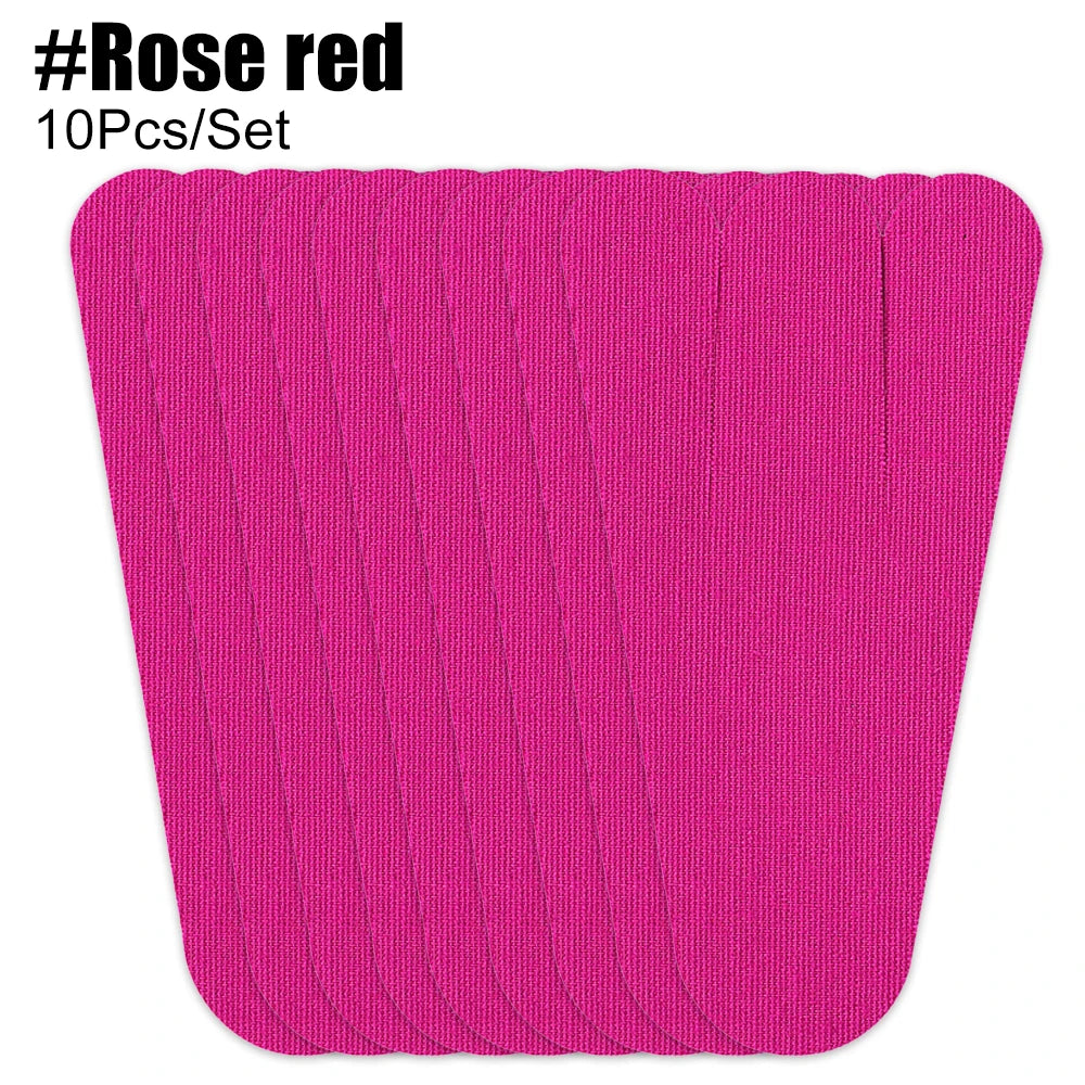 A stack of bright pink kinesiology tape strips for foot and joint support.