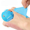 A hand is applying a blue elastic patch to the wrist area for sports pain relief.