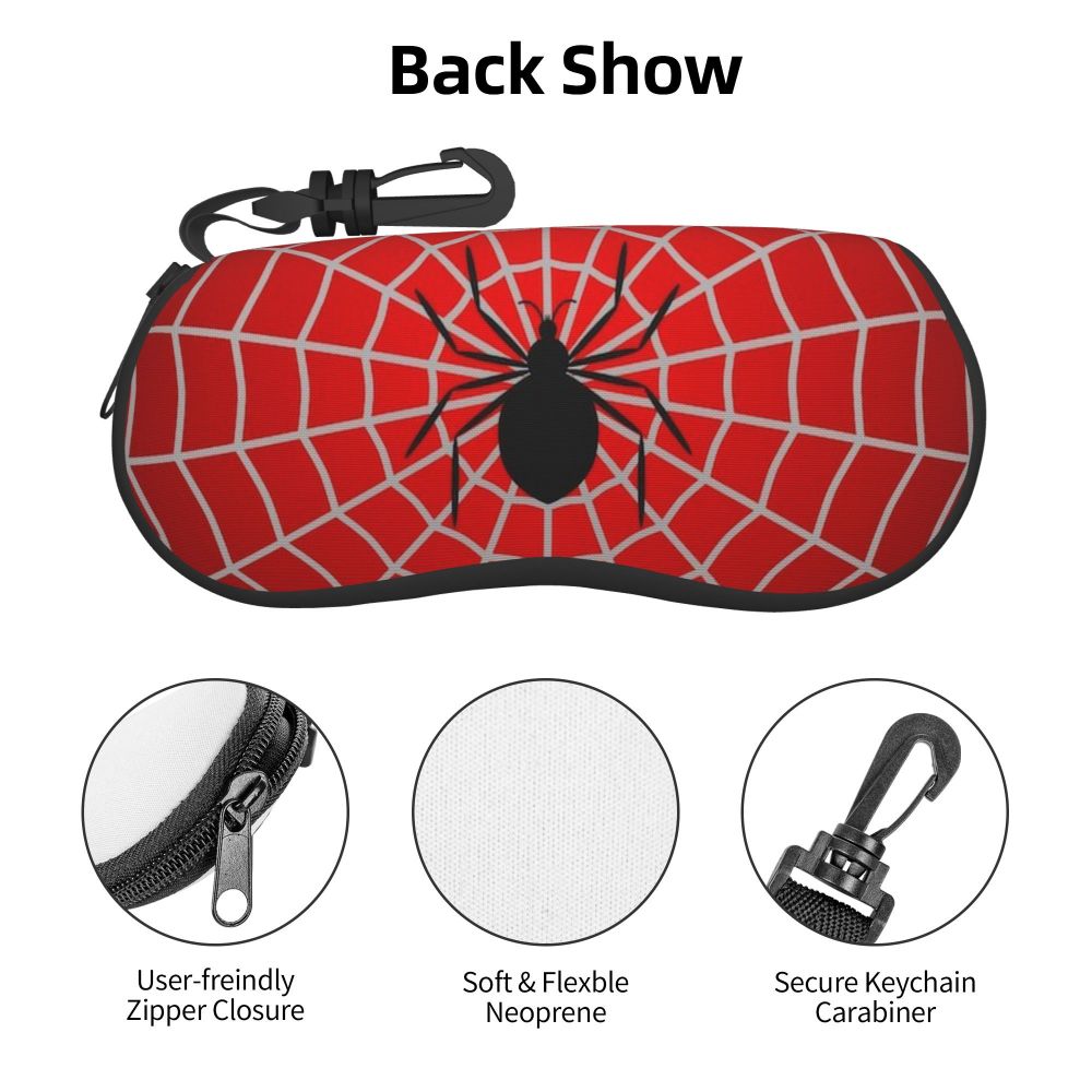 Red spider web patterned back show pouch with a zipper closure and keychain carabiner.