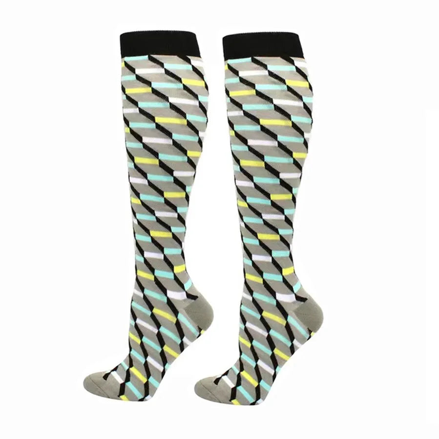 A pair of compression elastic socks featuring a geometric pattern in shades of gray, black, light blue, and yellow.