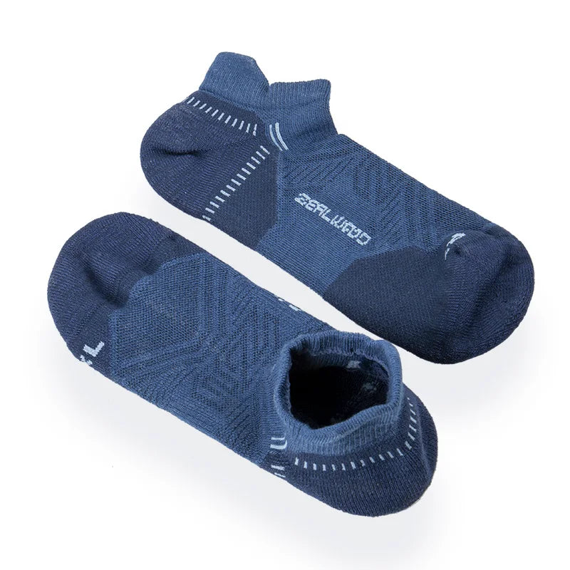 A pair of dark blue breathable performance running socks lying flat.