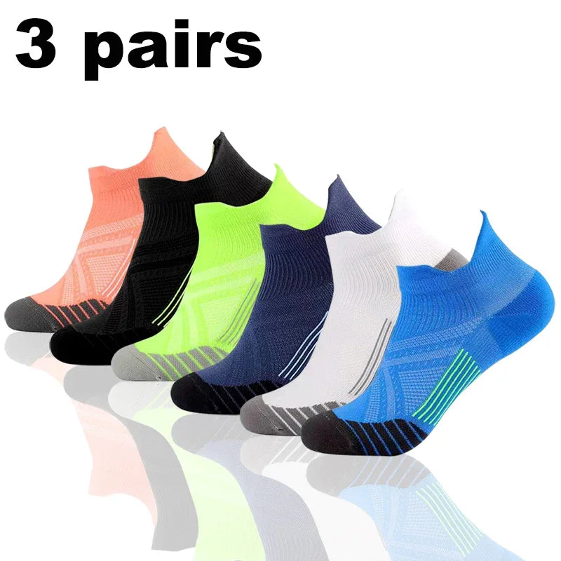 Three pairs of colorful performance compression sports socks displayed in a row.