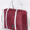 A maroon foldable travel duffel bag with white straps and handles shown flat.