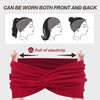 A red twisted criss cross elastic headband shown being worn on a person's head.