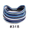 A colorful striped fabric headband tied in a bow, featuring shades of blue, purple, white, and brown.