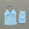 Light blue women's seamless backless fitness set top and shorts.