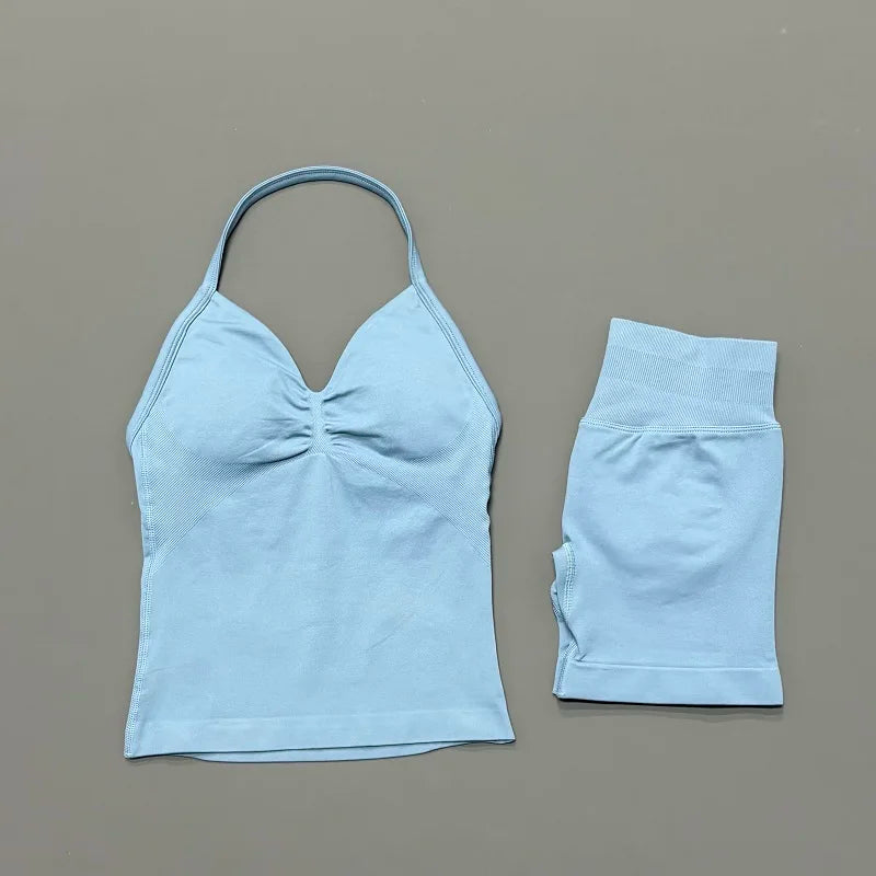 Light blue women's seamless backless fitness set top and shorts.