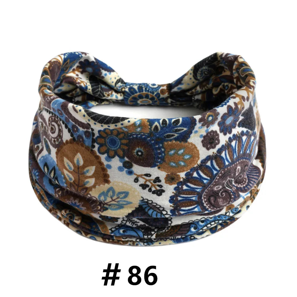 A patterned boho print cotton headband featuring blue, brown, and cream colors.