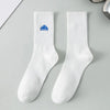 A pair of white men's athletic crew socks with a blue embroidered logo on the foot.
