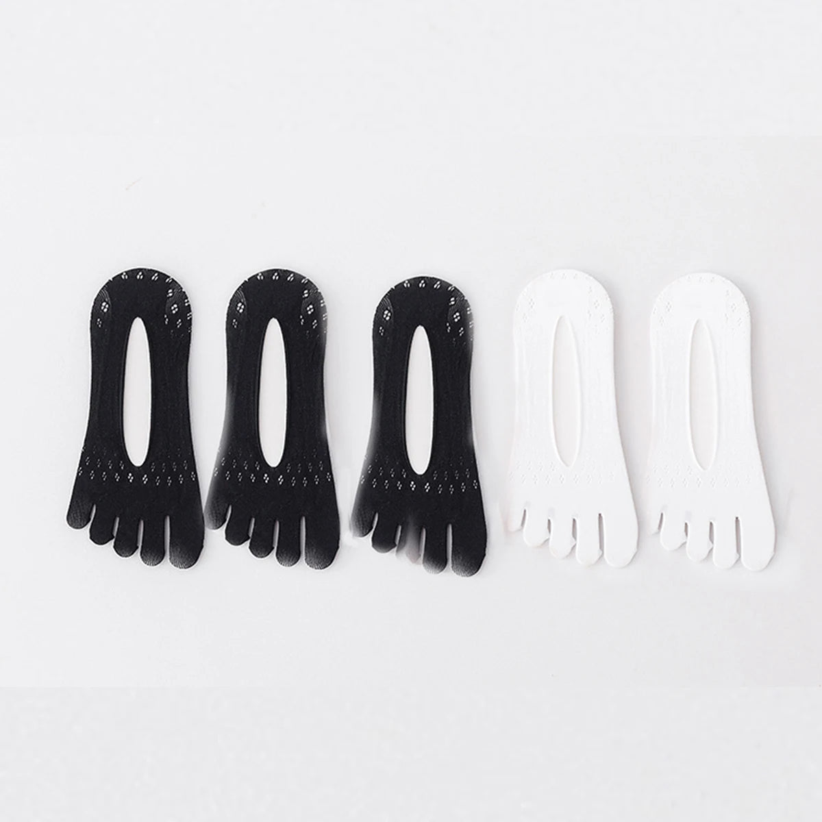 A pack of five ultra-thin invisible boat socks, three black and two white, laid out side by side.