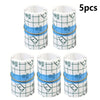 Five rolls of transparent self-adhesive finger protection tape in white and blue patterns.