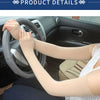 A person wearing beige breathable arm sleeves while driving a car.