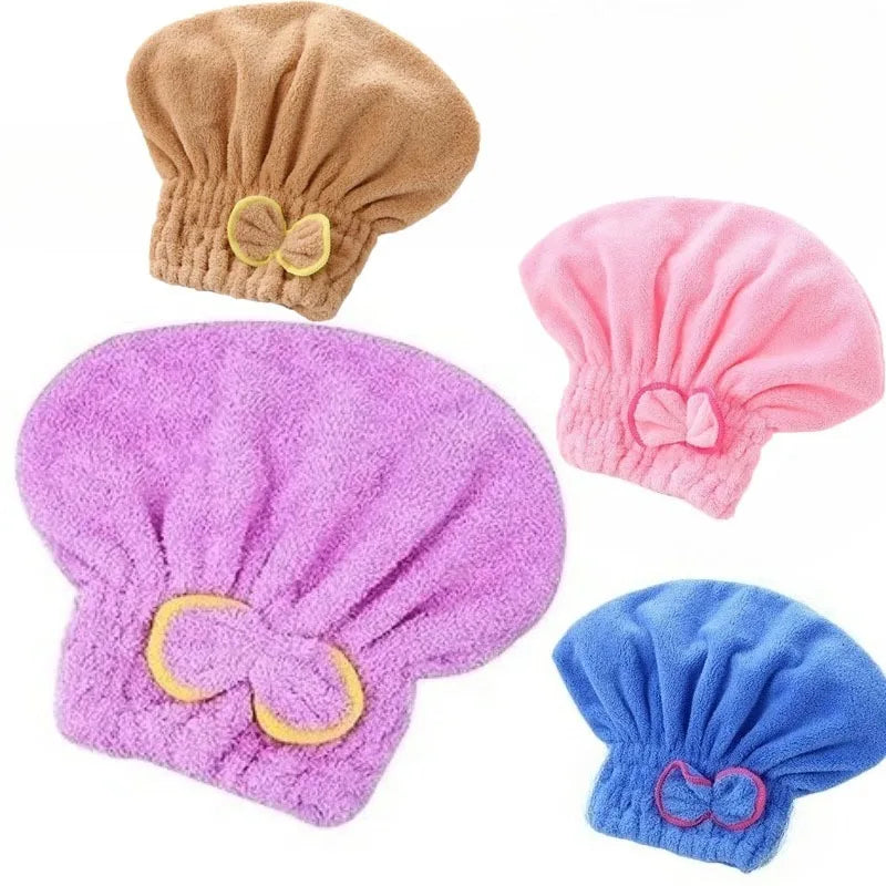 A set of pink and purple hair drying towel caps for quick drying