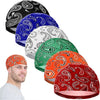 A collection of colorful printed headscarf caps displayed next to a man's head.