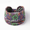 A colorful floral butterfly patterned fabric headband worn around the head.