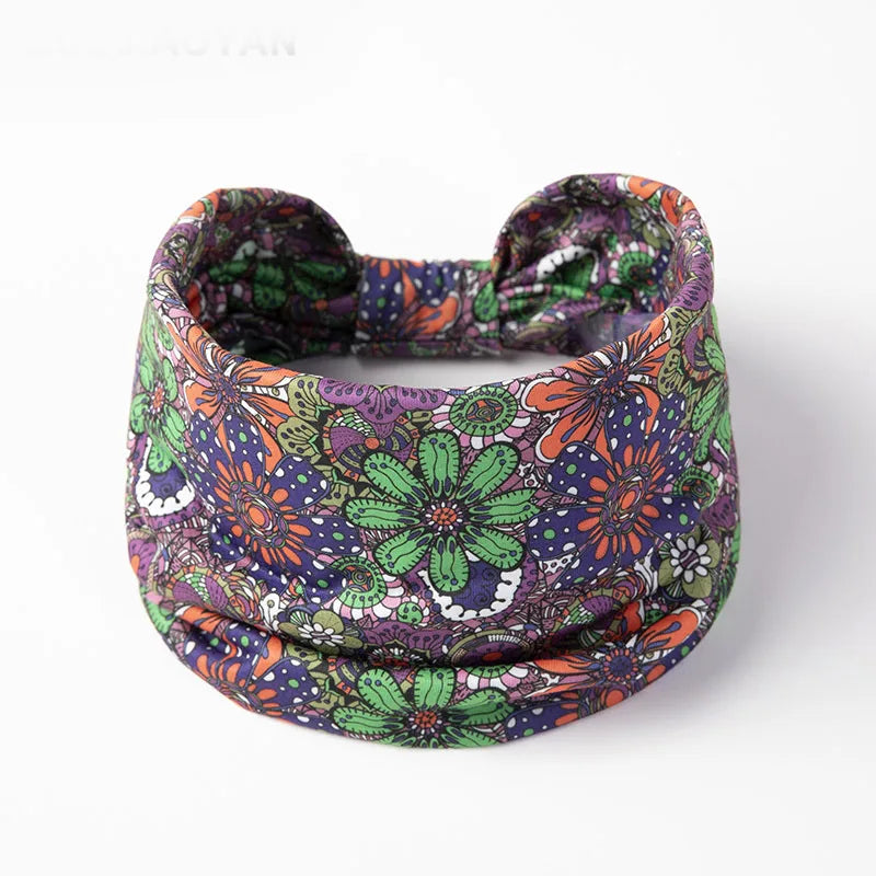 A colorful floral butterfly patterned fabric headband worn around the head.