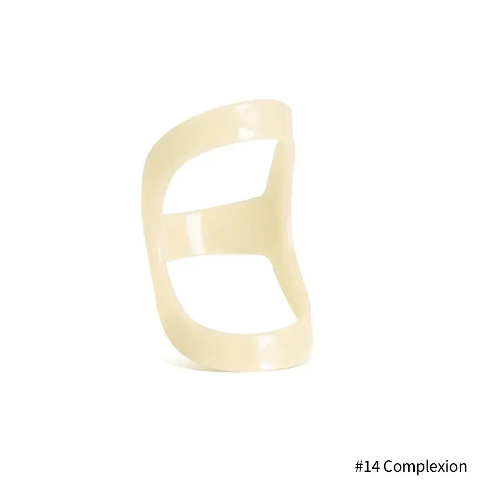 A beige ergonomic finger splint designed for joint support.
