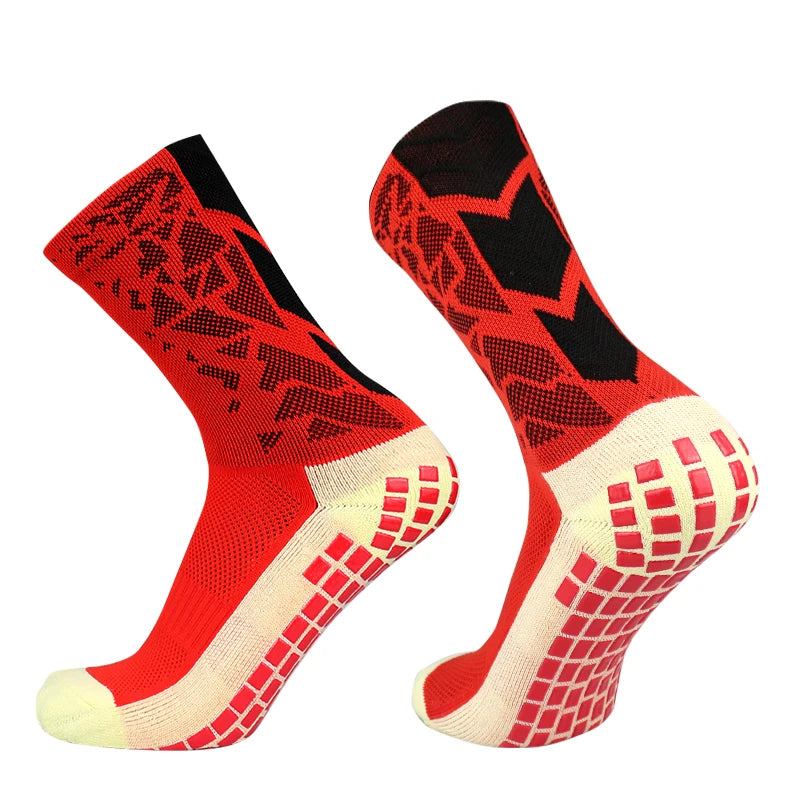 A pair of red and black anti-slip training socks shown from the side.