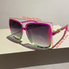 Pink retro sunglasses with a gradient lens and gold accents shown on a white surface.