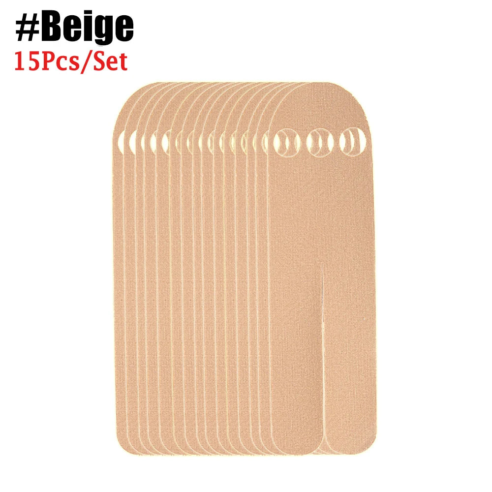 Ein Set beige Keratologie-Therapiotapes gestapelt.