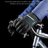 A hand wearing dark insulated gloves is gripping a bicycle handlebar, emphasizing wind protection and warmth.