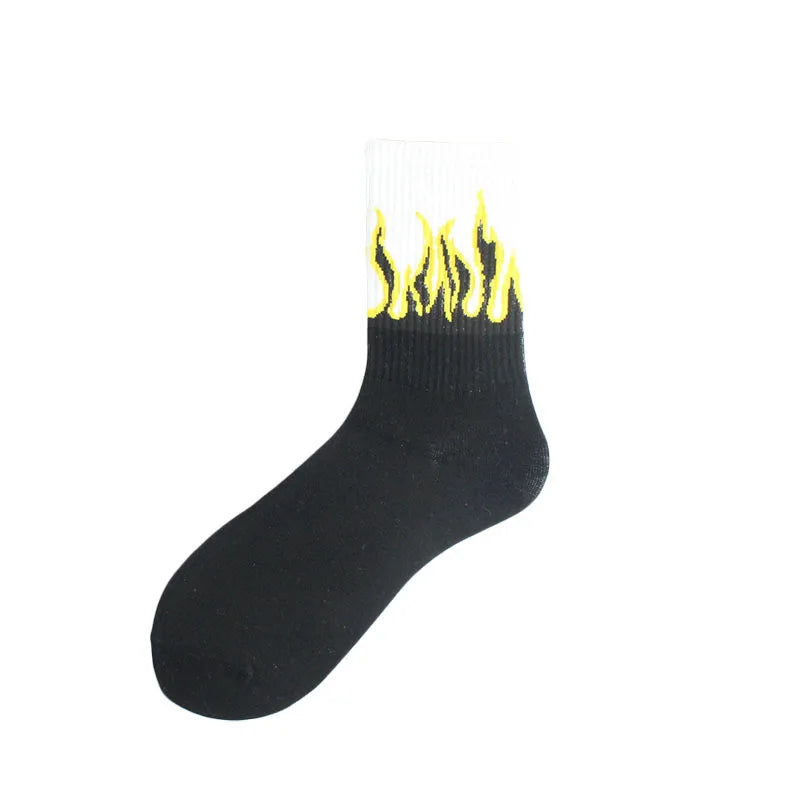 Black novelty socks with a yellow flame pattern on the toe and cuff.
