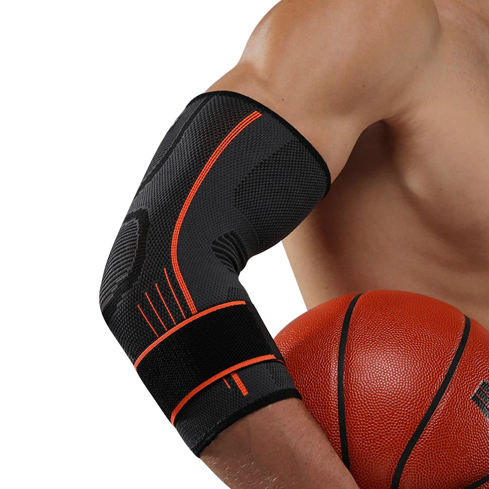 Black elbow compression sleeve worn on an arm next to a basketball.