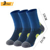 Three pairs of navy blue men's performance running and sport socks shown standing upright.