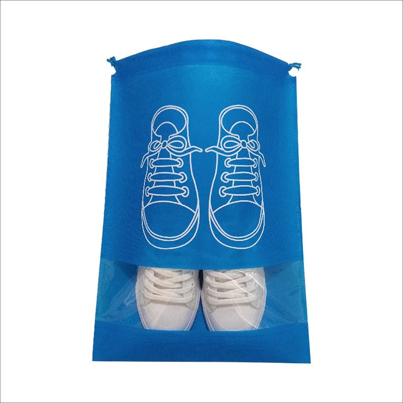 A blue reusable non-woven shoe storage bag with white outline drawings of shoes and a pair of white sneakers inside.