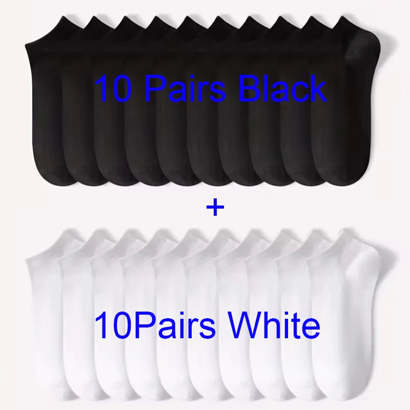 A display of 10 pairs of black and 10 pairs of white comfort fit ankle socks.