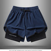Navy blue athletic shorts with black trim and drawstring shown flat lay