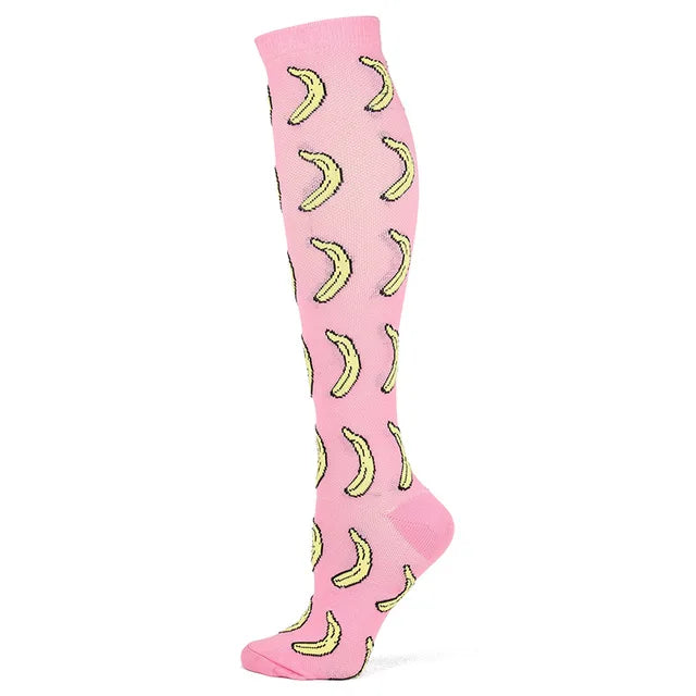 Pink compression socks with yellow crescent moon patterns