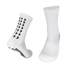 A pair of white multi-sport athletic grip socks, shown in a vertical view.