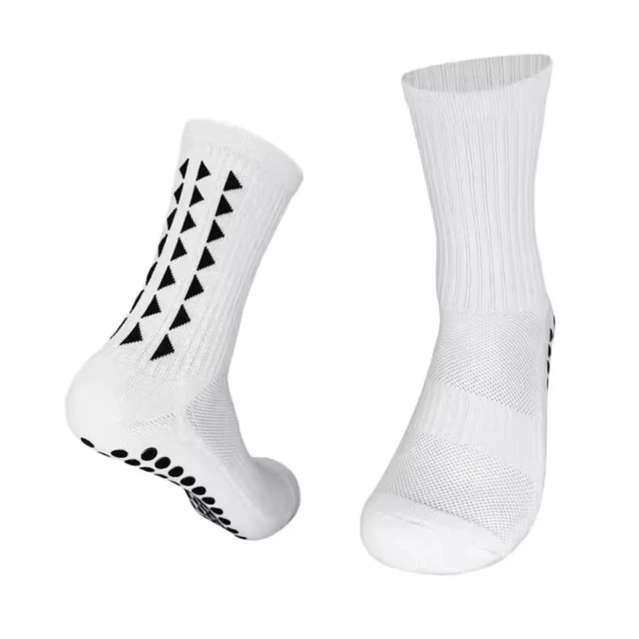 A pair of white multi-sport athletic grip socks, shown in a vertical view.