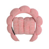 A pink microfiber skincare headband and wristband set with a floral design.