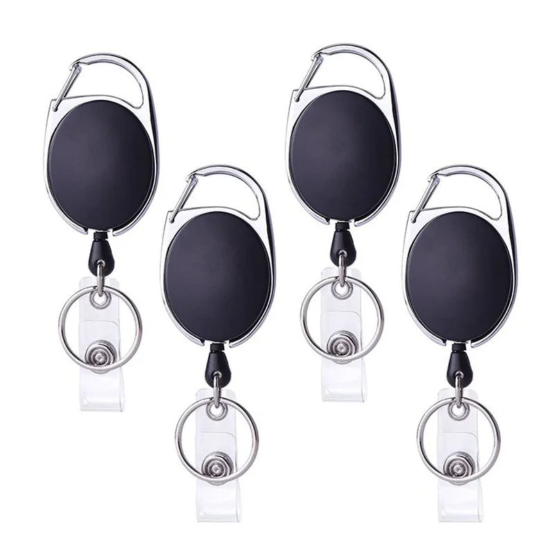 A set of black retractable ID badge reel keychains with silver rings.