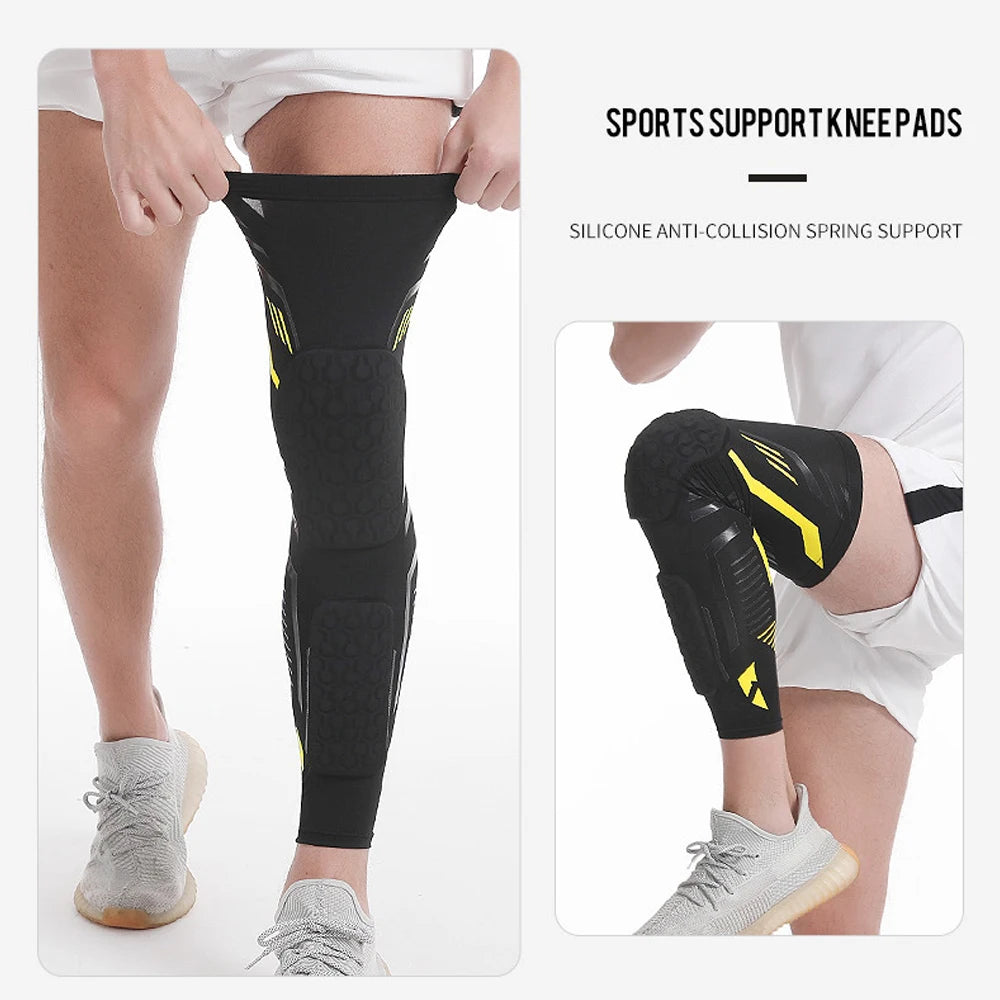 Black sports support knee pads worn on a leg, showing the compression sleeve and spring support features.