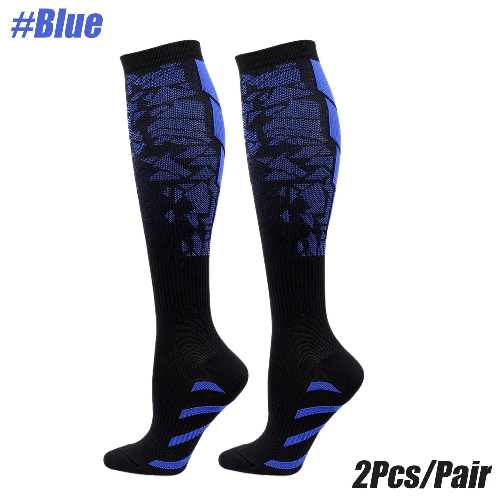 A pair of black compression socks with blue accents, designed for multi-use sport.
