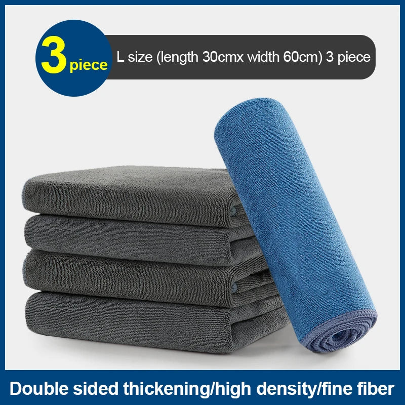 Three gray microfiber car cleaning towels stacked next to a blue towel, showing double-sided thickening and high density.