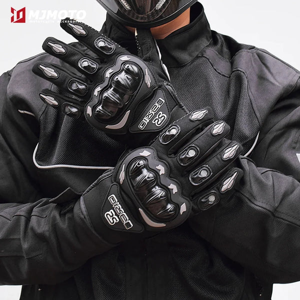 A close-up of black breathable motorcycle racing gloves worn by a person.