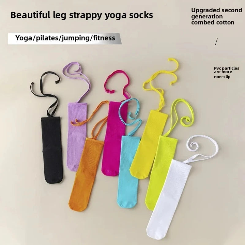 A collection of colorful strappy yoga socks made from combed cotton for fitness and Pilates