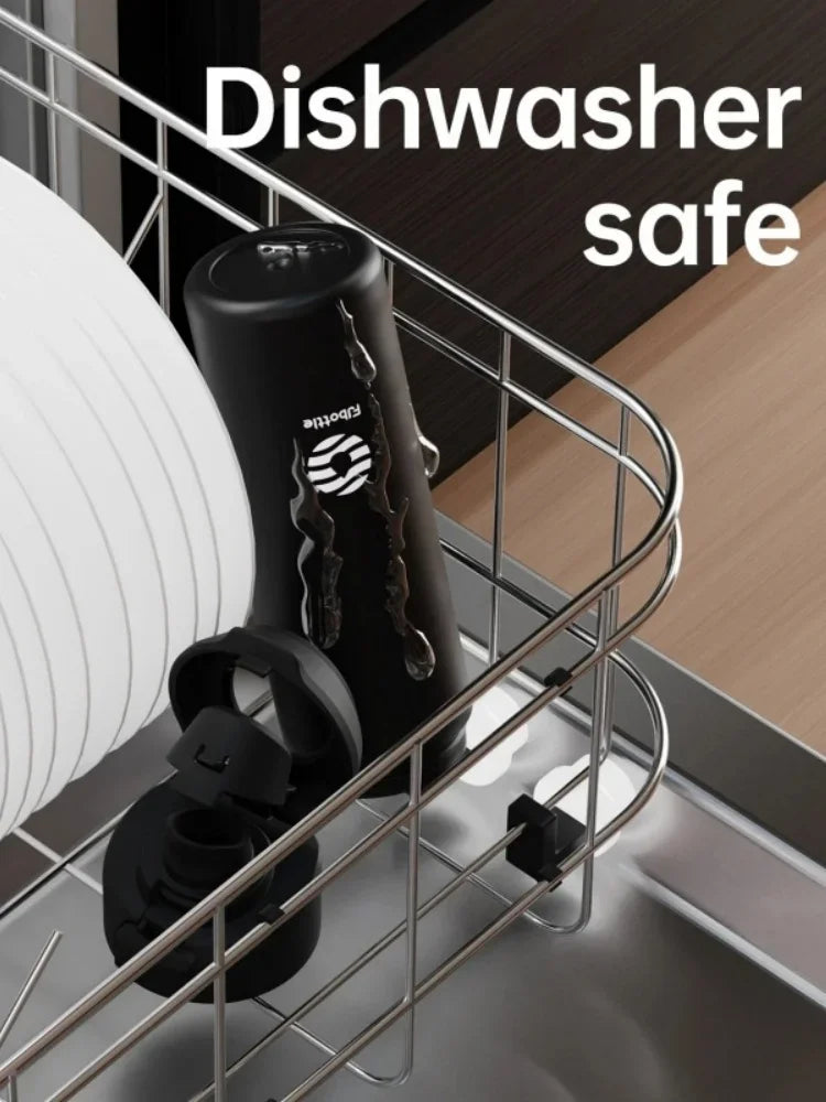 A black insulated stainless steel sports water bottle with a magnetic lid is stored in a metal dishwasher safe rack.