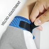 A hand adjusts a blue Velcro strap on a black wrist brace for sports gloves.