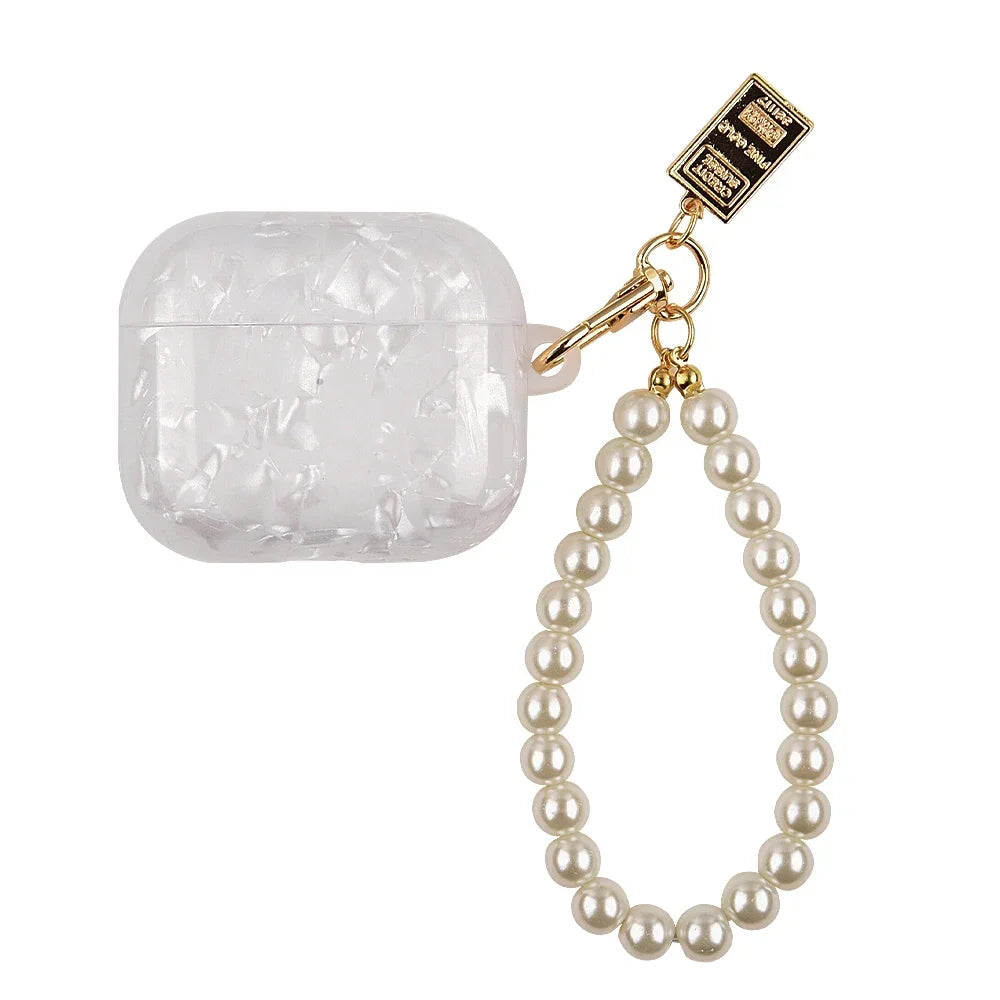 A clear protective case for AirPods Pro with a gold chain and pearl necklace.