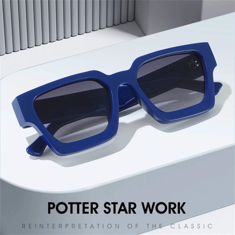 Blue retro square frame sunglasses displayed on a white surface.