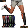 A pair of black sports compression socks worn by a person during physical activity.