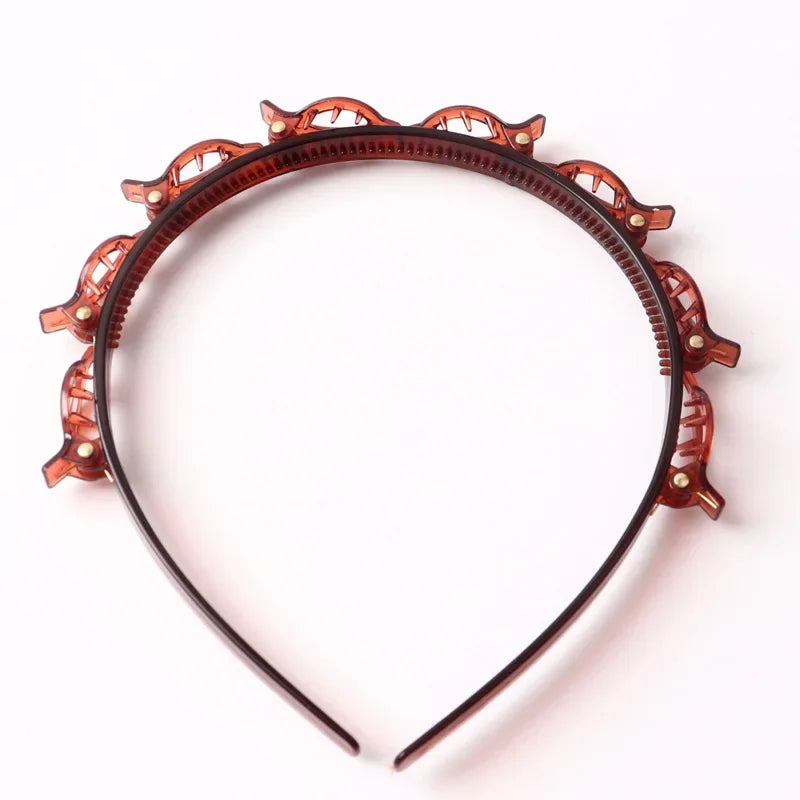 Diadema con detalles decorativos de hojas naranjas para el cabello.