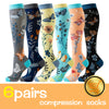 Six pairs of knee-high compression socks featuring various butterfly patterns in blue, orange, and floral designs.